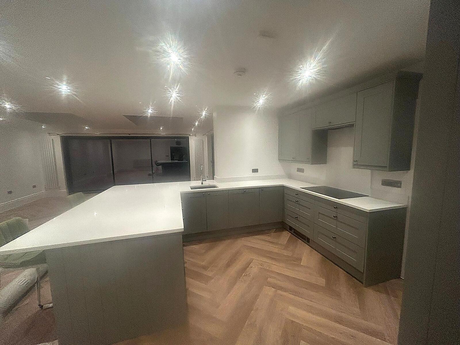 Contemporary Kitchen with Herringbone Floor